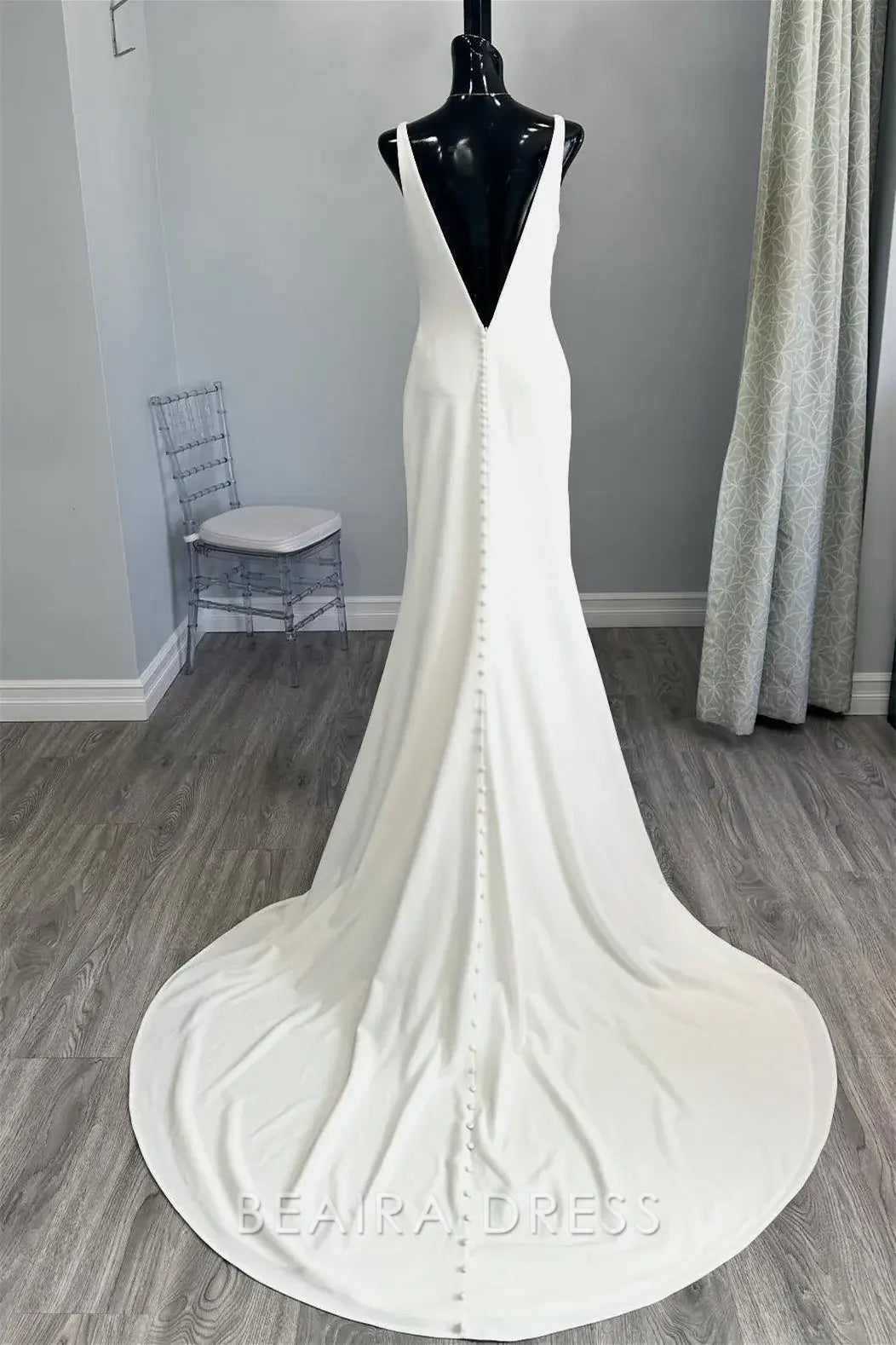 Beaira Elegant Plunging V - Neck Mermaid Wedding Dress with Minimalist Design and Flowing Train for Effortless Bridal Elegance