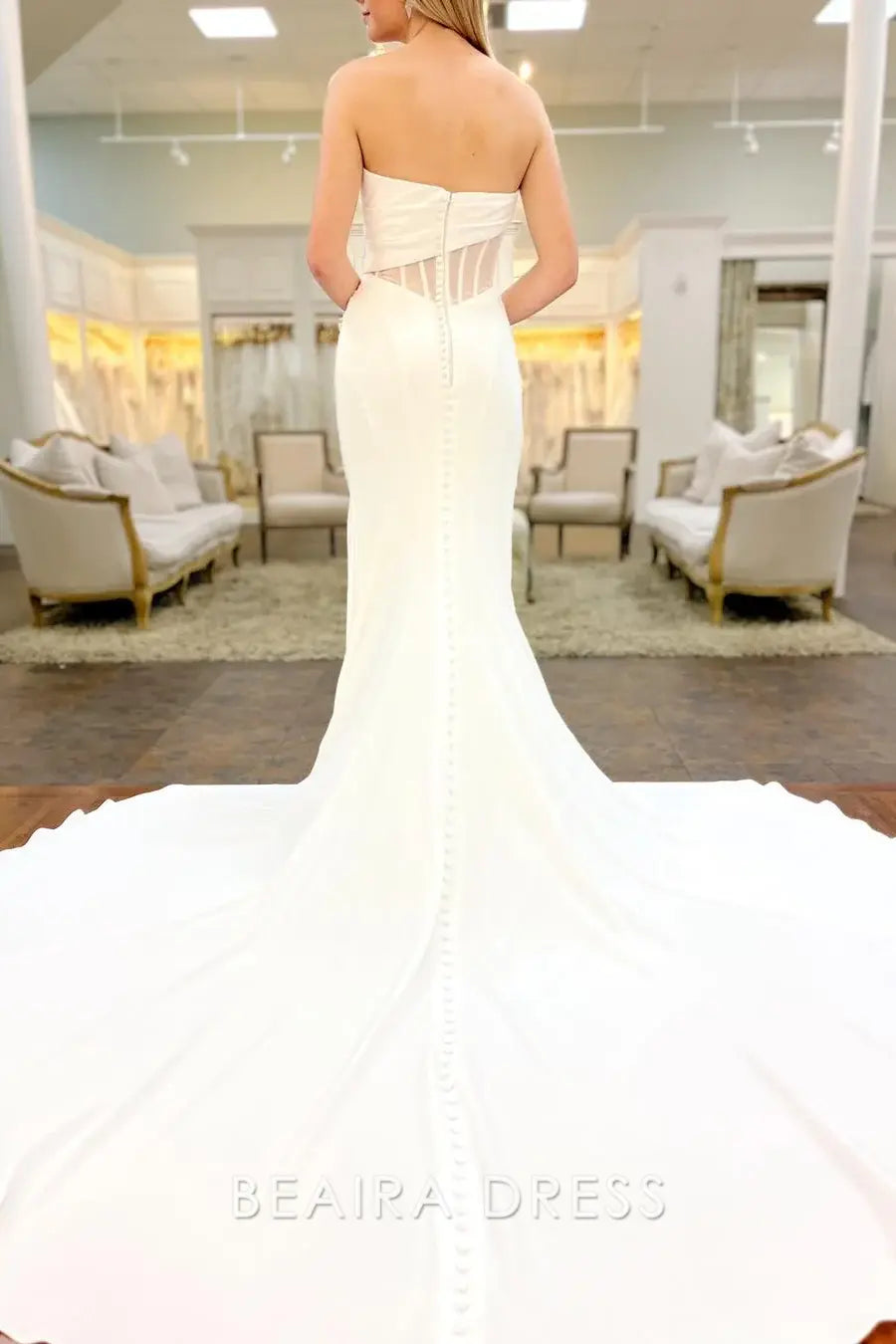Beaira Elegant Strapless Sweetheart Neckline Wedding Dress with Ruched Bodice Sheer Cutout Detailing and Mermaid Train for Modern Bridal Elegance