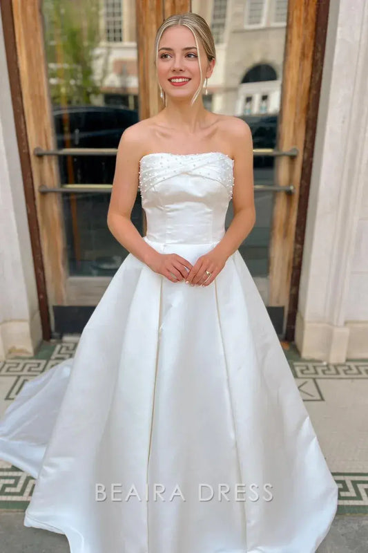 Beaira Elegant Strapless Ball Gown Wedding Dress with Pearl - Embellished Twisted Bodice and Voluminous Satin Skirt for Timeless Bridal Grandeur