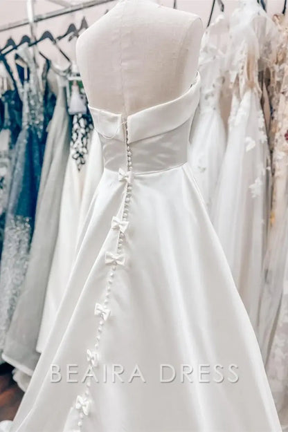 Beaira Elegant Strapless Ball Gown Wedding Dress with Structured Bodice and Flowing Satin Skirt for Timeless Bridal Grace
