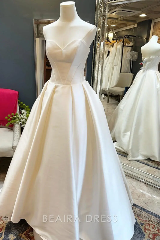Beaira Elegant Strapless Ball Gown Wedding Dress with Structured Bodice and Voluminous Satin Skirt for Timeless Bridal Beauty